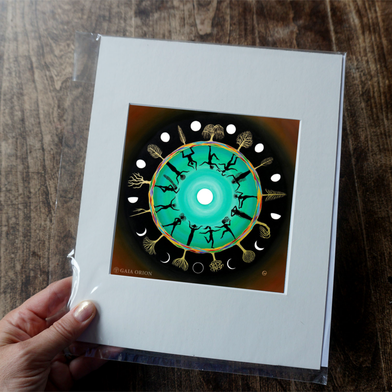 Thirteen Moons - Prints on Paper showing women dancing in a circle with moon phases and tree illustrations.