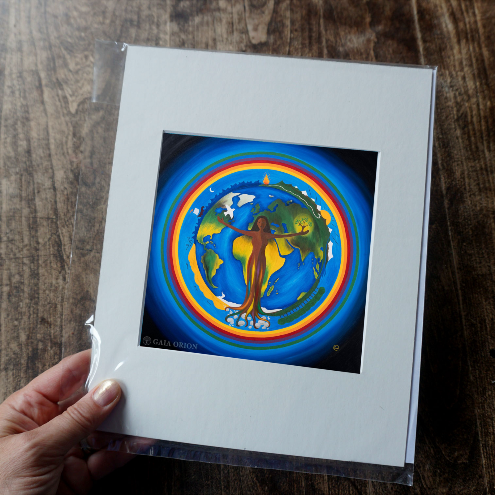 Mother Nature - Prints on Paper features a spiritual union of a woman with Earth surrounded by nature elements and colorful rings.