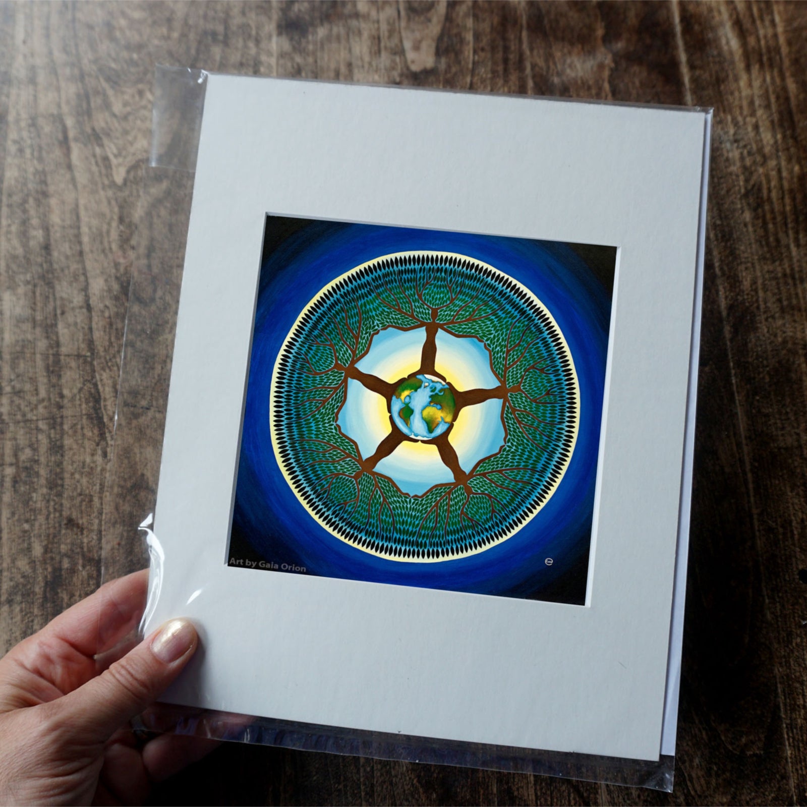 Equilibrium - Prints on Paper showing a circular tree design with Earth at the center symbolizing harmony with nature.