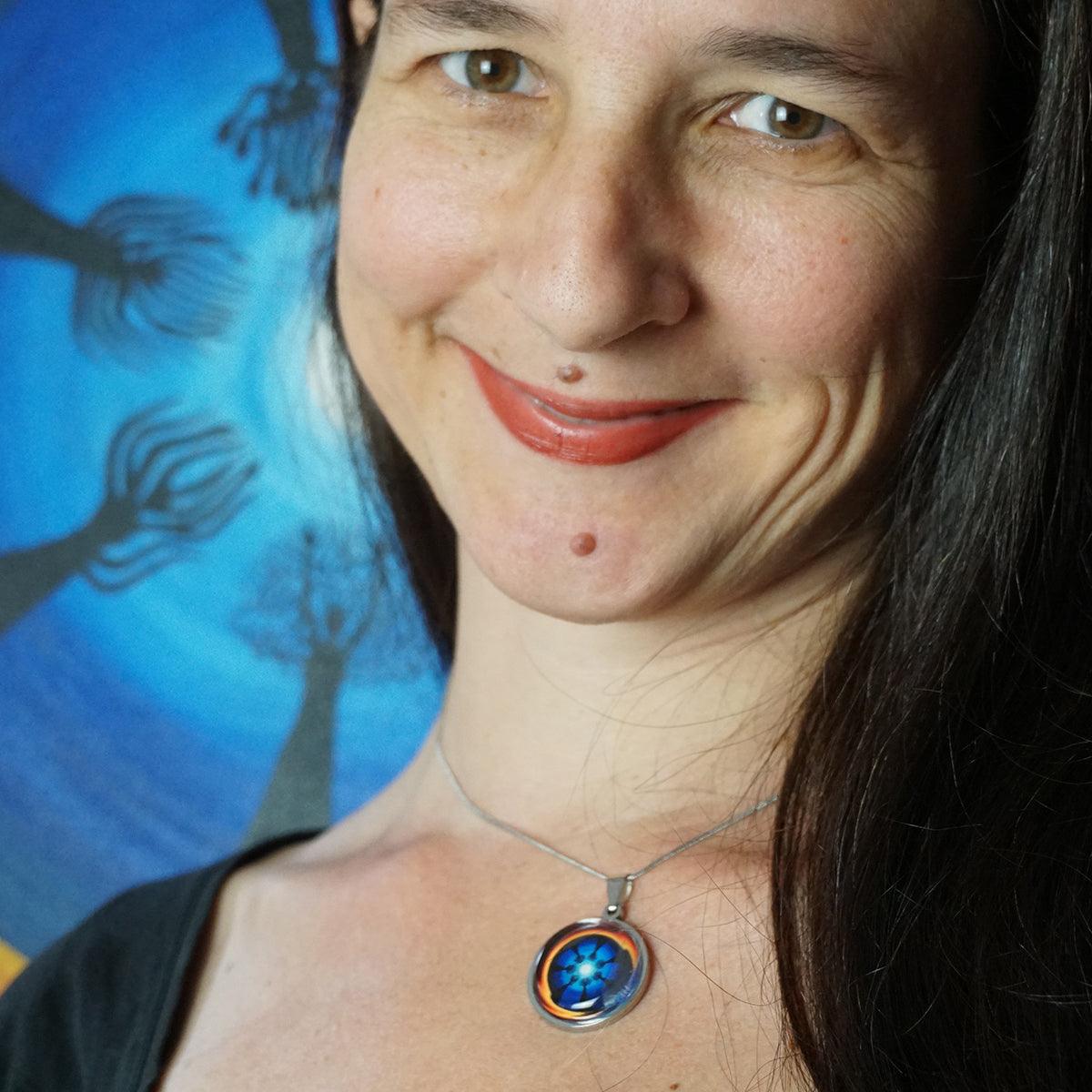 Moon Ritual Necklaces featuring a mandala design celebrating female bodies and lunar cycles on a silver chain.