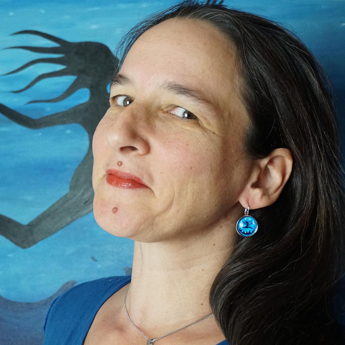 I am Free! Earrings featuring a blue night sky with stars and moon, platinum brass medallions, handmade in Canada.