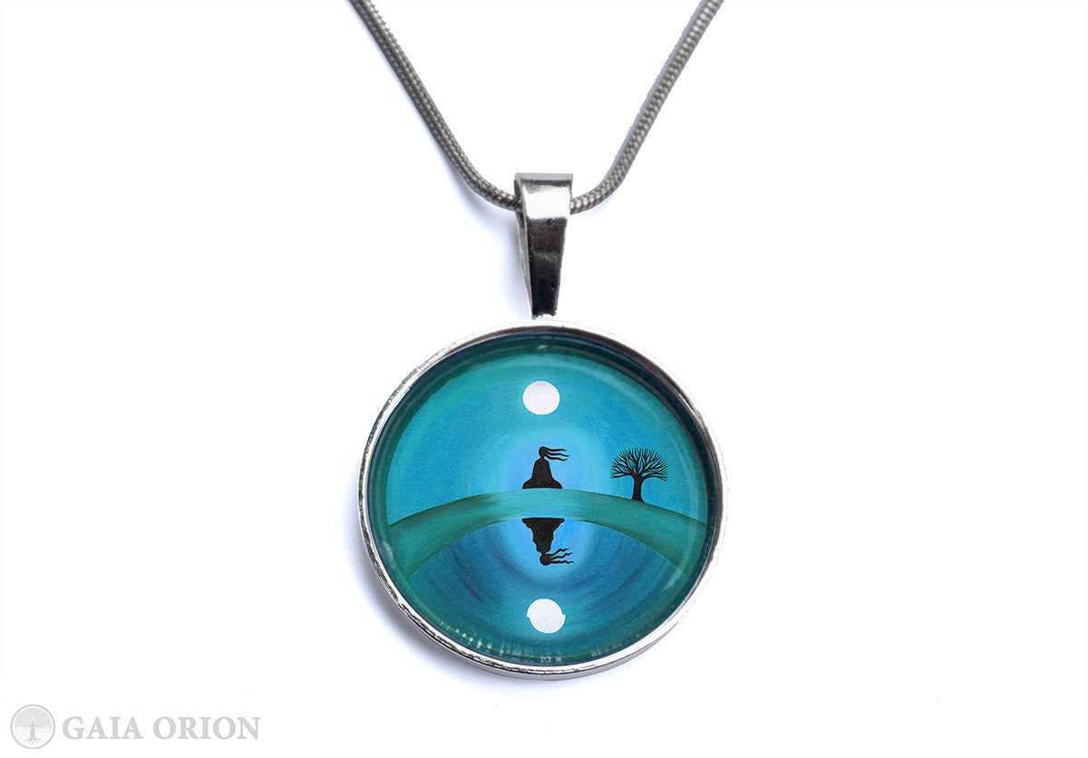 At Peace Necklaces featuring serene art on a silver medallion with a durable glass dome and 16-inch snake chain.