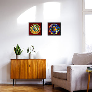 two mandala artwork on a wall red and gold and chakra colours