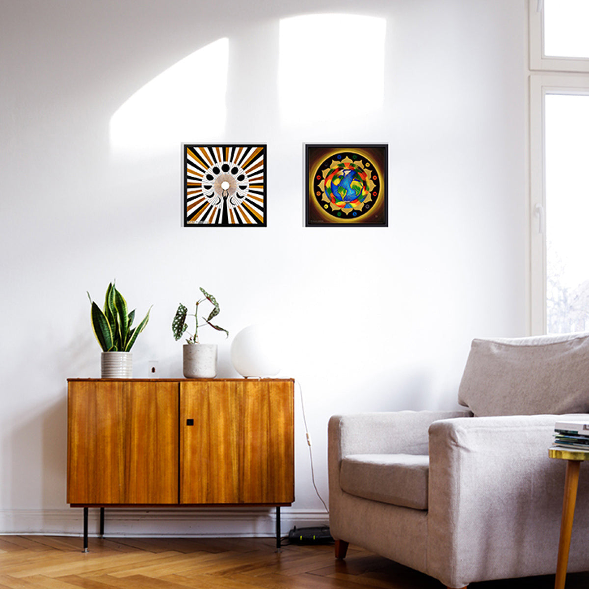 two prints on canvas with the planet earth like a chakra and a mandala about the moon cycles