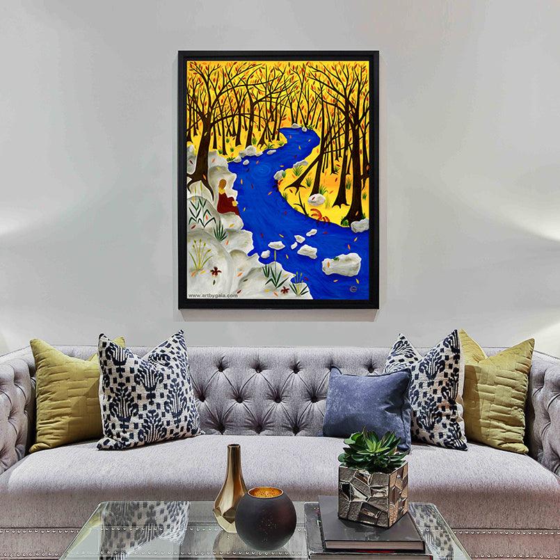 Autumn forest a person sitting by a river