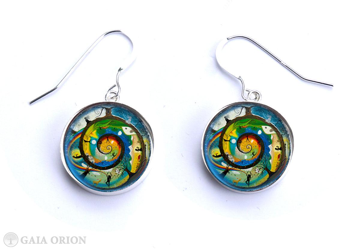 Her Journey Earrings featuring colorful spiral art on sterling silver medallions with durable glass dome protection.