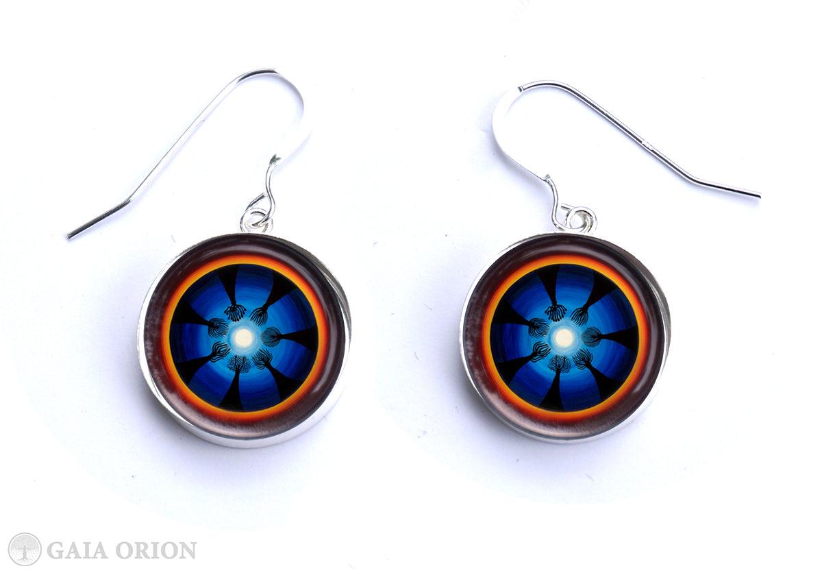 Moon Ritual Earrings with blue mandala design on sterling silver medallions, handmade art jewelry celebrating the Moon and female cycle.